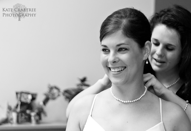 The bride smiles with excitement as she thinks about her Val Halla wedding in Cumberland Maine