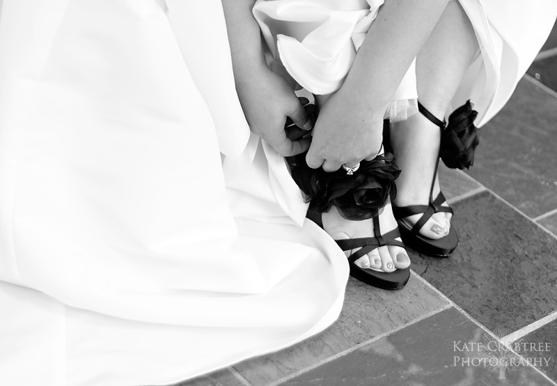 The bride puts on her gorgeous shoes in Freeport Maine