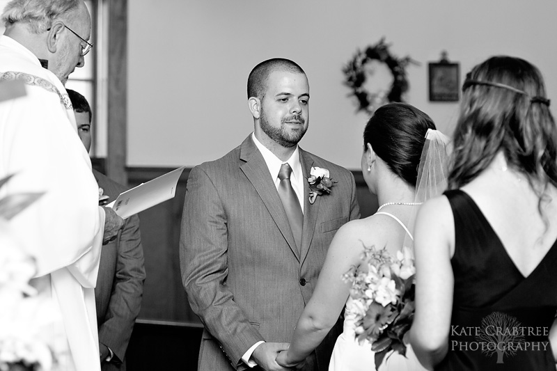 At a church in Freeport Maine the bride and groom say their vows.