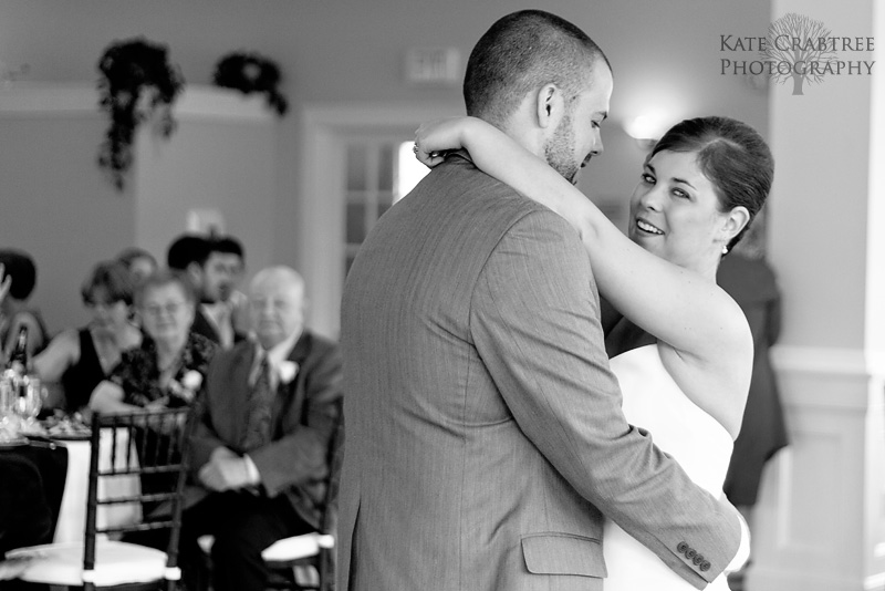 The bride looks over during their special first dance at Val Halla in Cumberland Maine