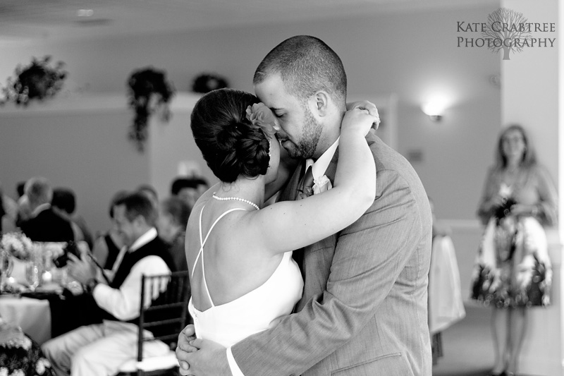 The bride shares a tender moment with her groom during their first dance at Val Halla in Cumberland Maine