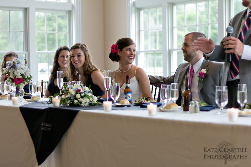 The bride and groom laugh during a toast by the best man at their Val Halla wedding.