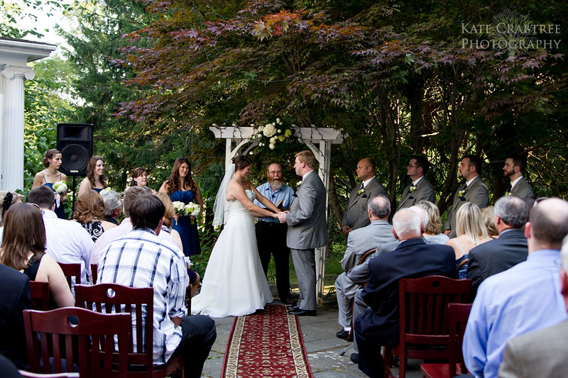 The bride and groom say their vows in front of friends and family at the Whitehall Inn in Camden Maine