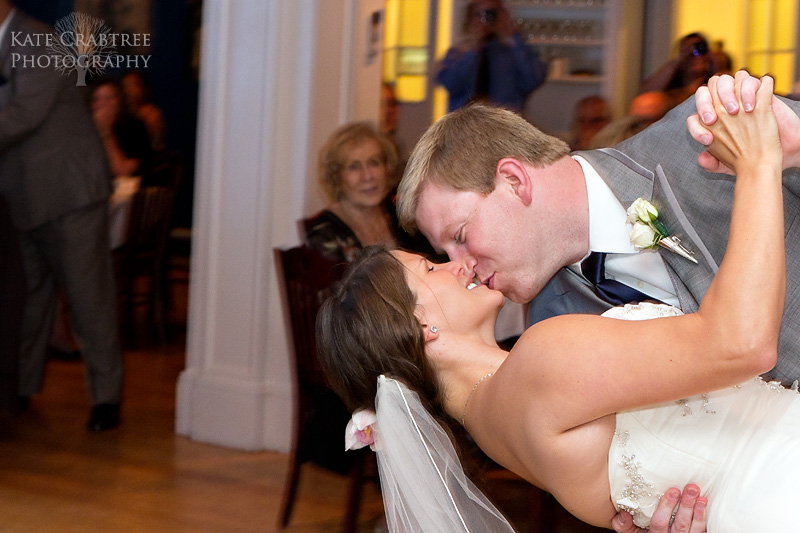 The groom dips the bride during their first dance at the Whitehall Inn