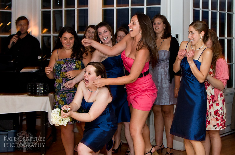 A bridesmaid makes a vailant leap to catch the bouquet during her friend's Whitehall Inn wedding.