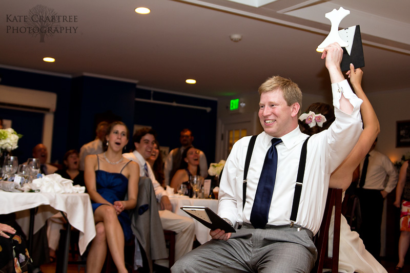 The bride and groom play a fun and embarassing game during their Whitehall Inn wedding reception