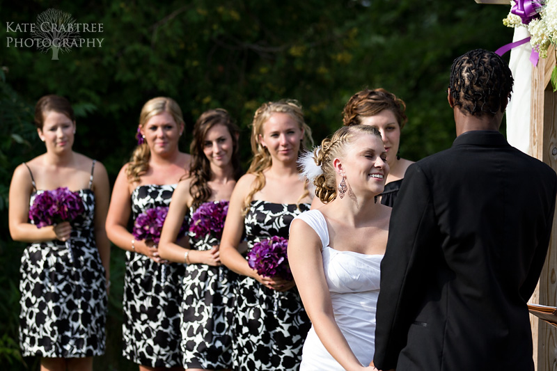 A glowing bride says her vows at her wedding ceremony at the Lakeview Golf Course in Central Maine