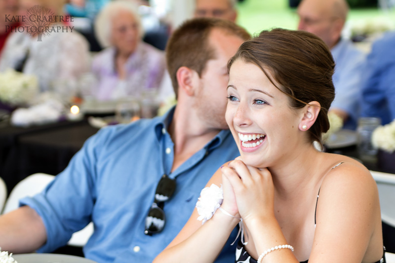 At the Lakeview Golf Course a bridesmaid laughs at her date's comment in Central Maine