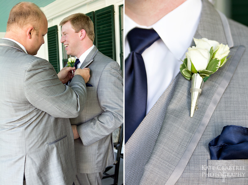 A groomsman pins a corsage on the groom on the Whitehall Inn's porch