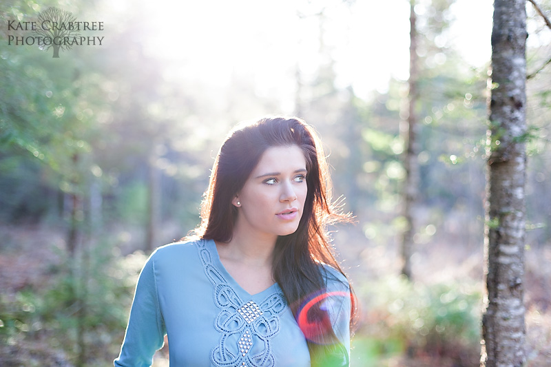 Gorgeous sunflare during a fashion shoot in the woods in Bangor Maine