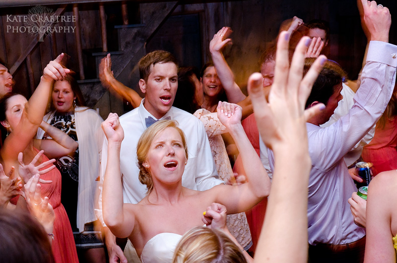 The bride and groom dance with their friends and family at their Maine reception