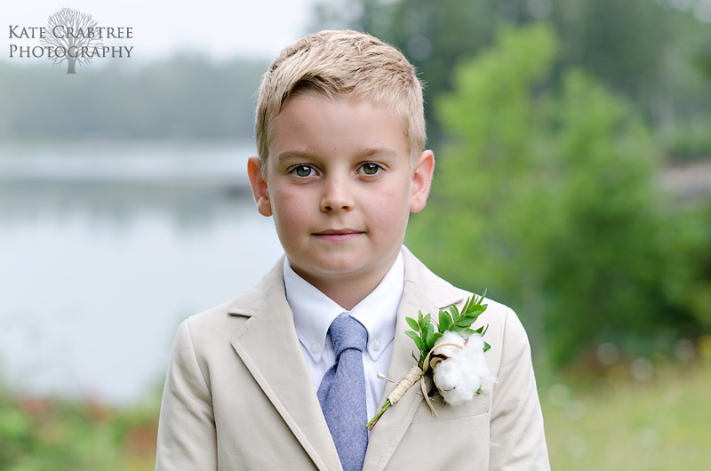 A groomsman in a suit at a midcoast Maine wedding