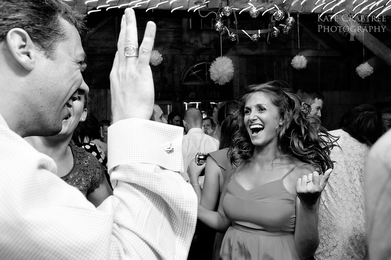 Maine wedding photographer Kate Crabtree captures an energetic dance photo at a North Haven Maine wedding