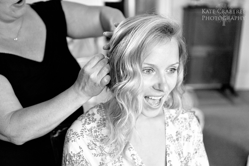 An excited bride has her hair done by hair stylist Kim Doll of Maine