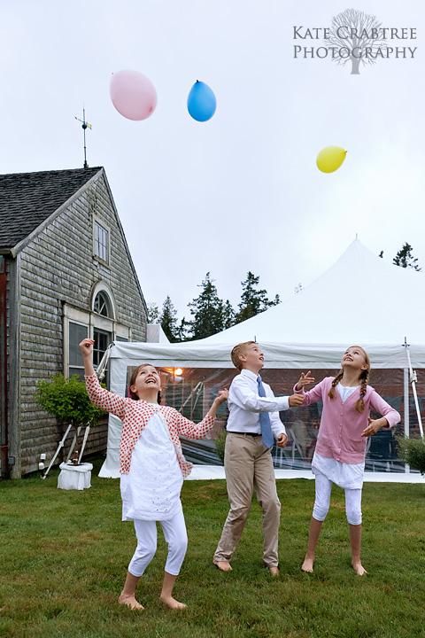 At a midcoast Maine wedding children celebrate with balloons at the reception