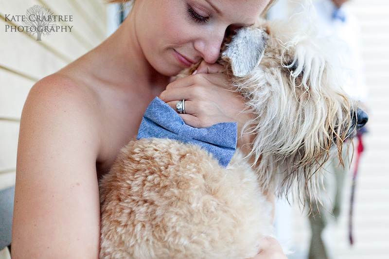 The bride, Susannah Stone, hugs her dog, Beau, at her North Haven Maine wedding
