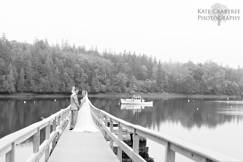 Susannah Stone and Gardner Brown pose at the end of a North Haven Maine dock