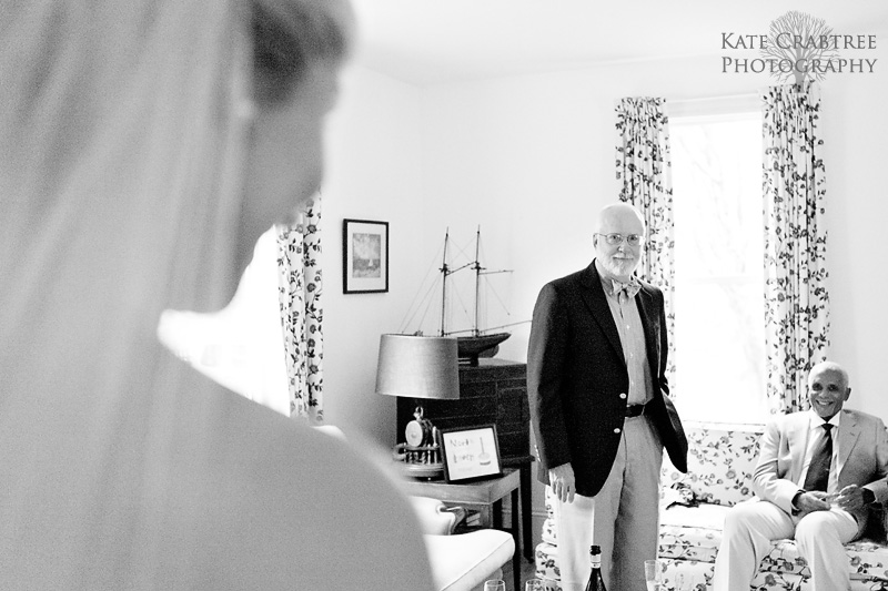 The father of the bride gets a first look at his daughter at her coastal Maine wedding