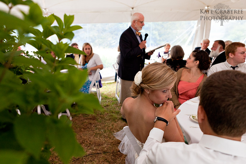 In this coastal Maine wedding photo the father of the bride toasts the newly married couple