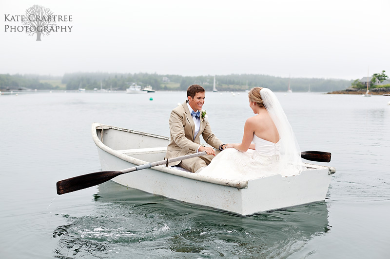 Susannah Stone and Gardner Brown row away together in a rowboat during their Maine wedding