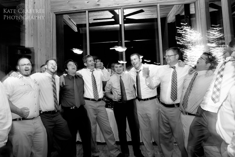 Several guys sing and dance at a wedding reception at Sunday River in western Maine