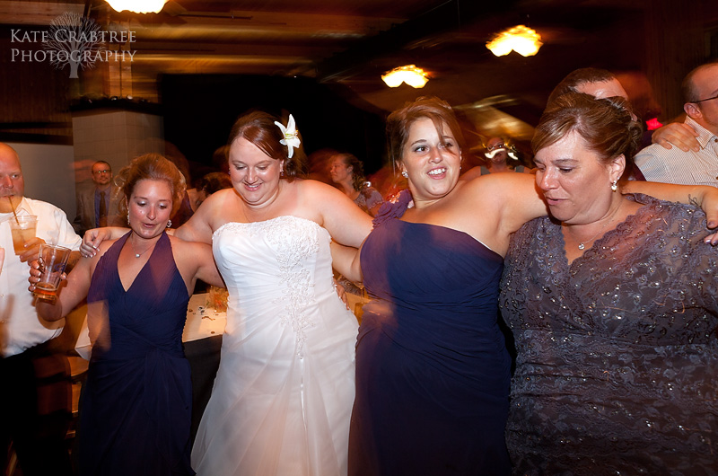 The bride and her bridal party dance together in this photo at a wedding reception at Sunday River in Maine