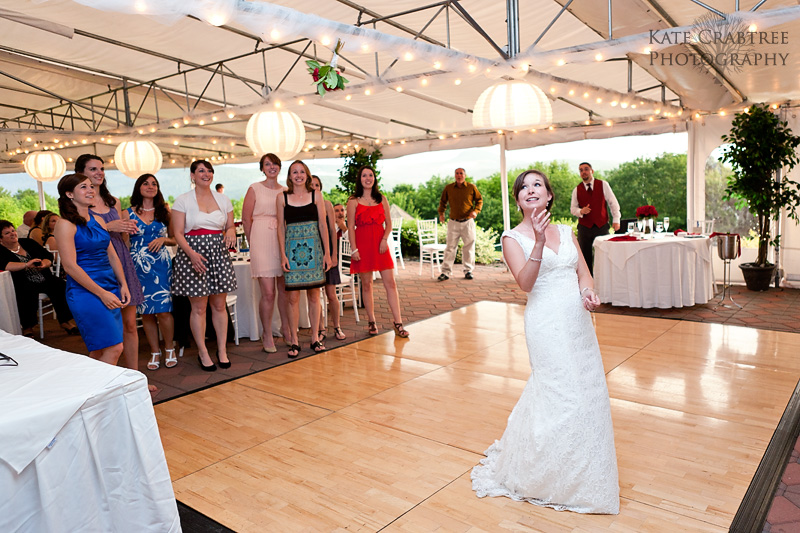 The bride throws her bouquet to all the single women at her wedding reception at the Lucerne Inn in central Maine