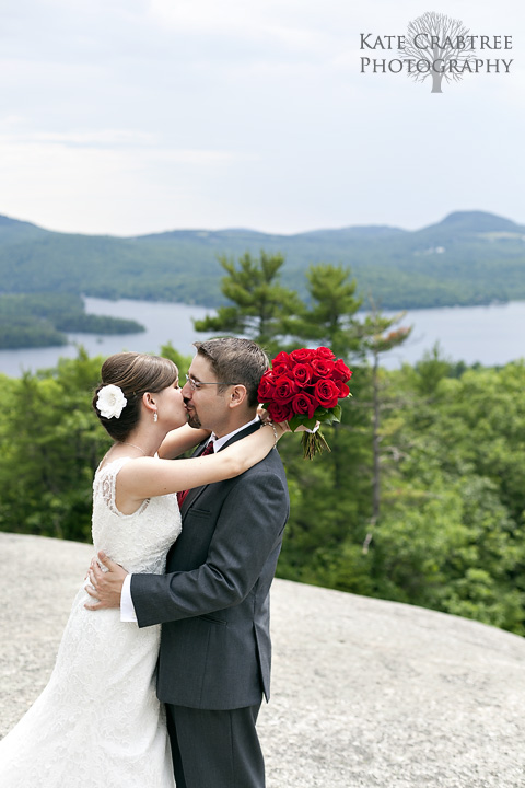 Laura and Mark look adorable during their wedding portraits on Sunset Rock in Dedham Maine