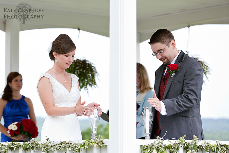 Laura and Mark light a unity candle at Lucerne Inn