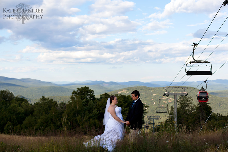 The bride and groom share a moment during their portrait session at Sunday River in Maine