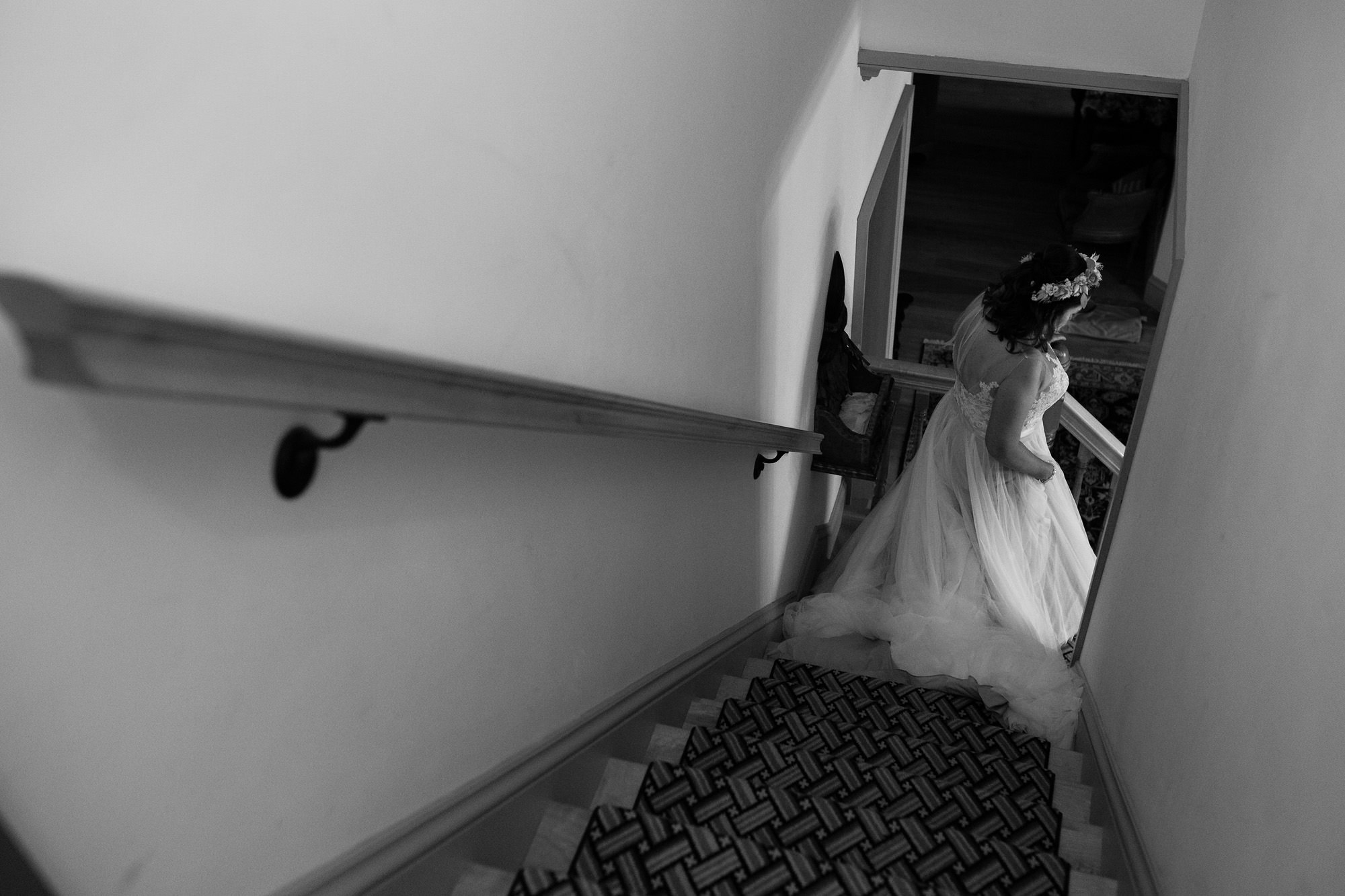 A bride walks down the stairs at her Sugar Hill New Hampshire wedding