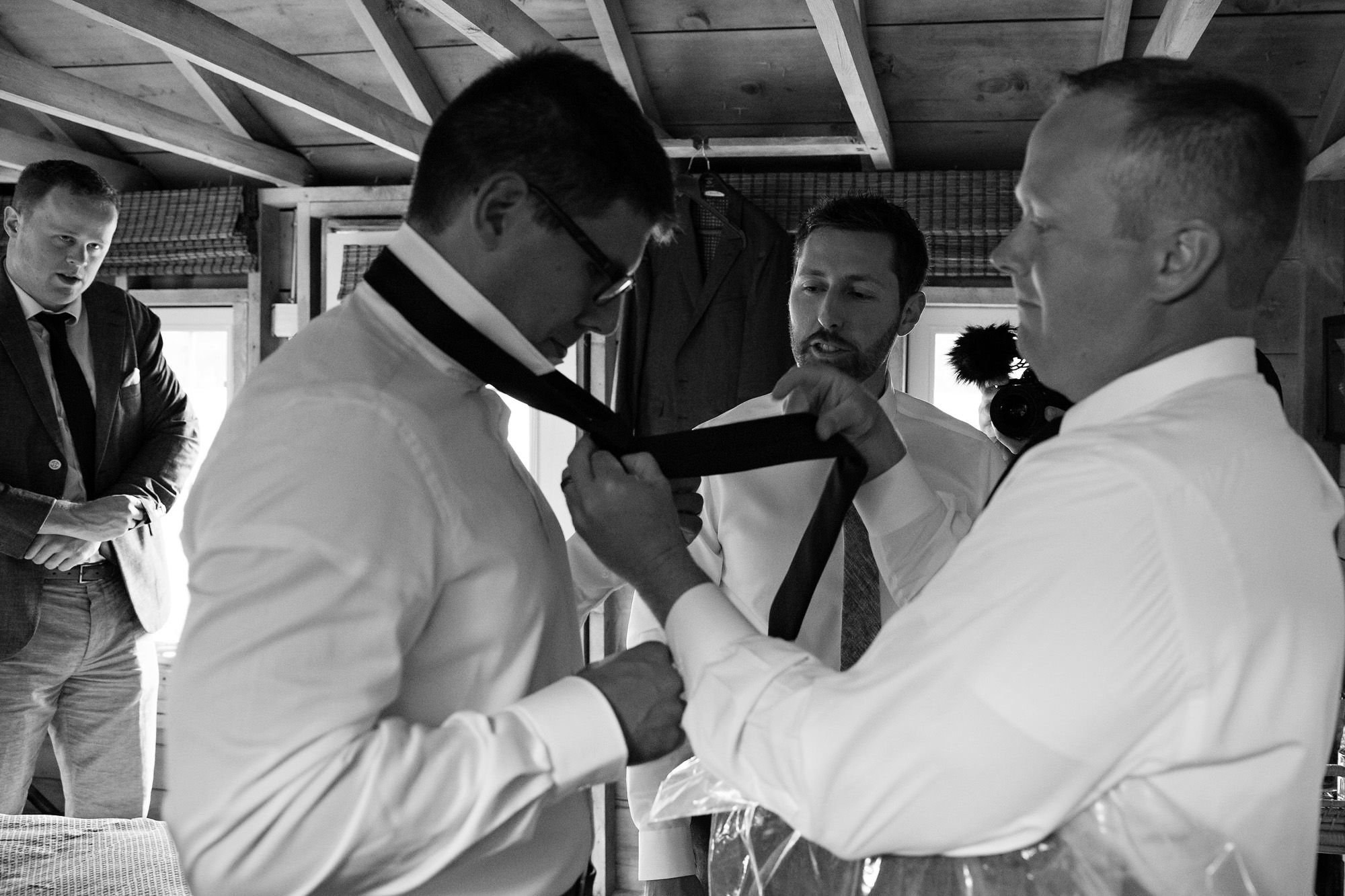 The groom and his groomsmen get ready at the Barn at Flanagan Farm in Buxton, Maine