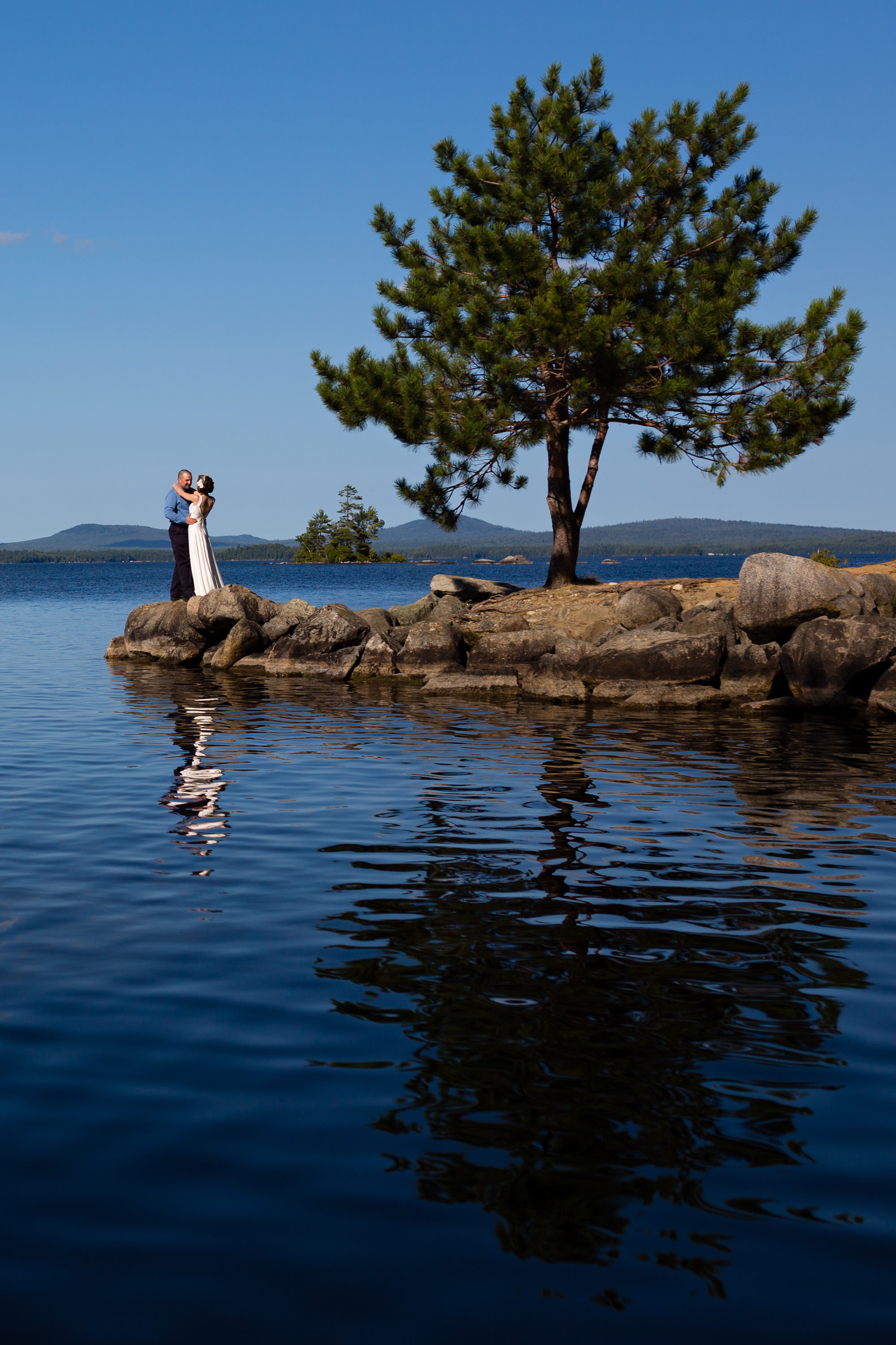 Bride and groom portraits at New England Outdoor Center in Millinocket, Maine