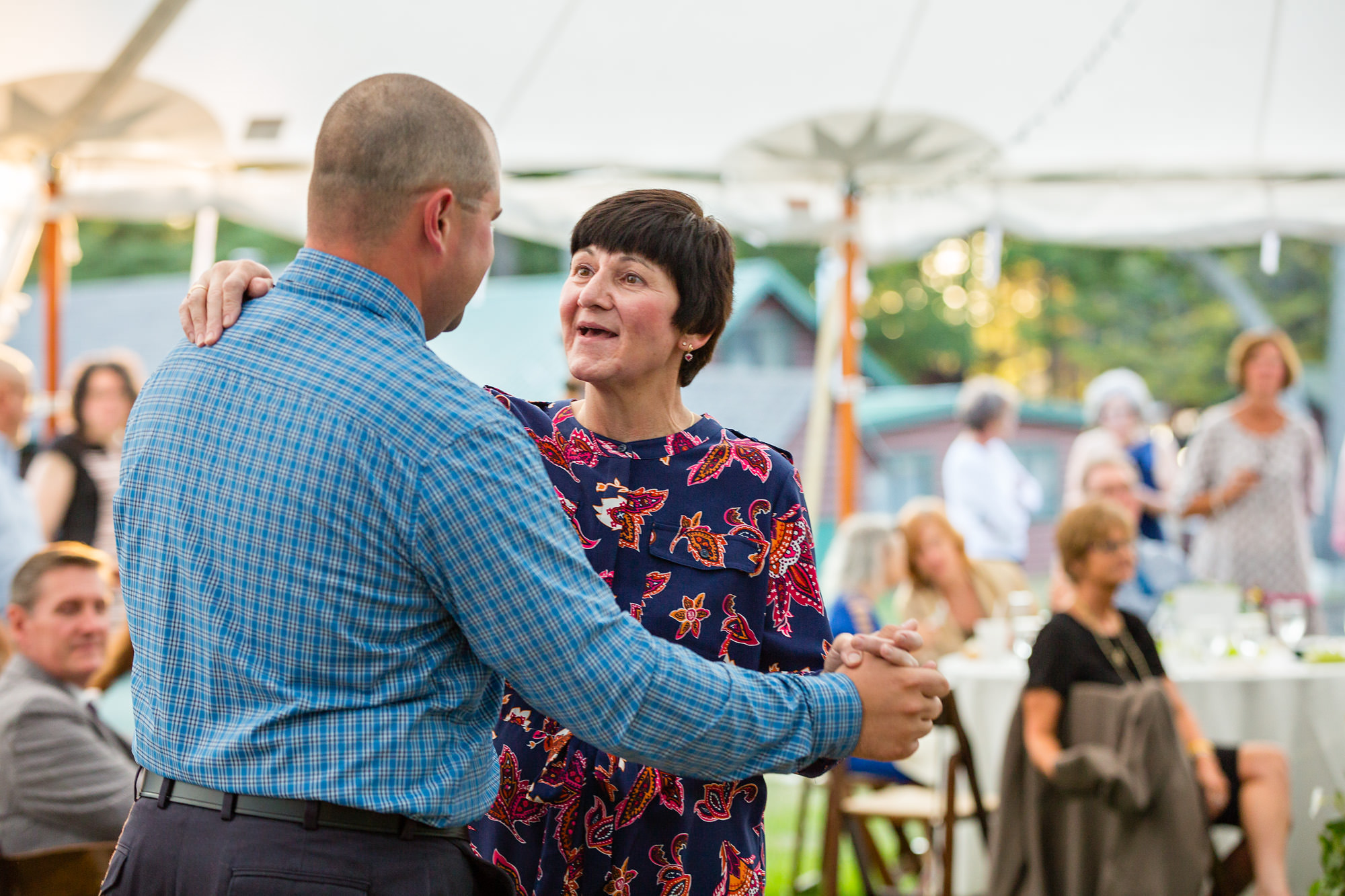 A sweet mother son dance at a wedding at the New England Outdoor Center