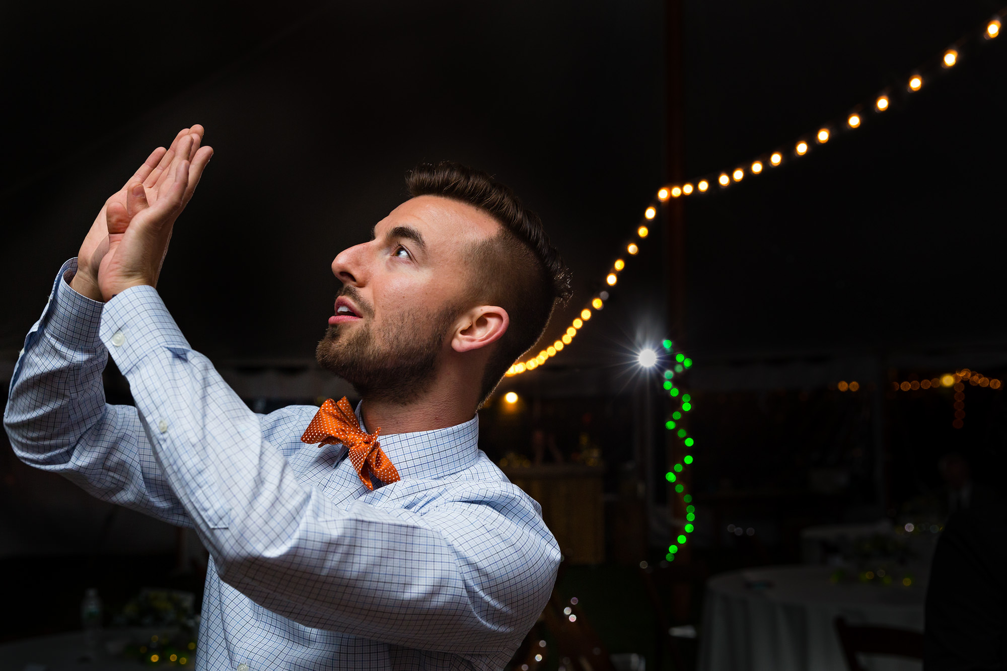 A candid and fun moment on a dance floor at a Maine wedding.
