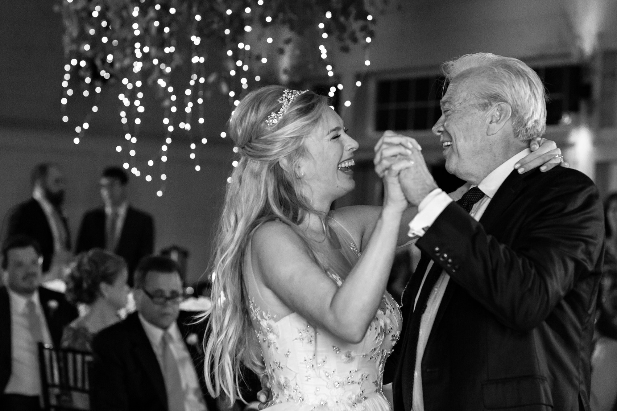 A happy first dance shared with the bride and her father at a Hidden Pond wedding.