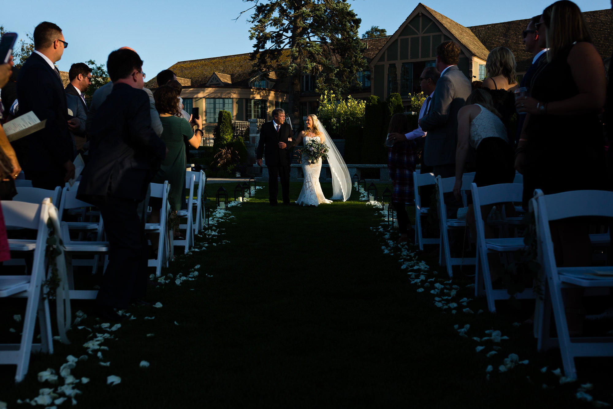 The bride walks down the aisle at her Bar Harbor Club wedding ceremony
