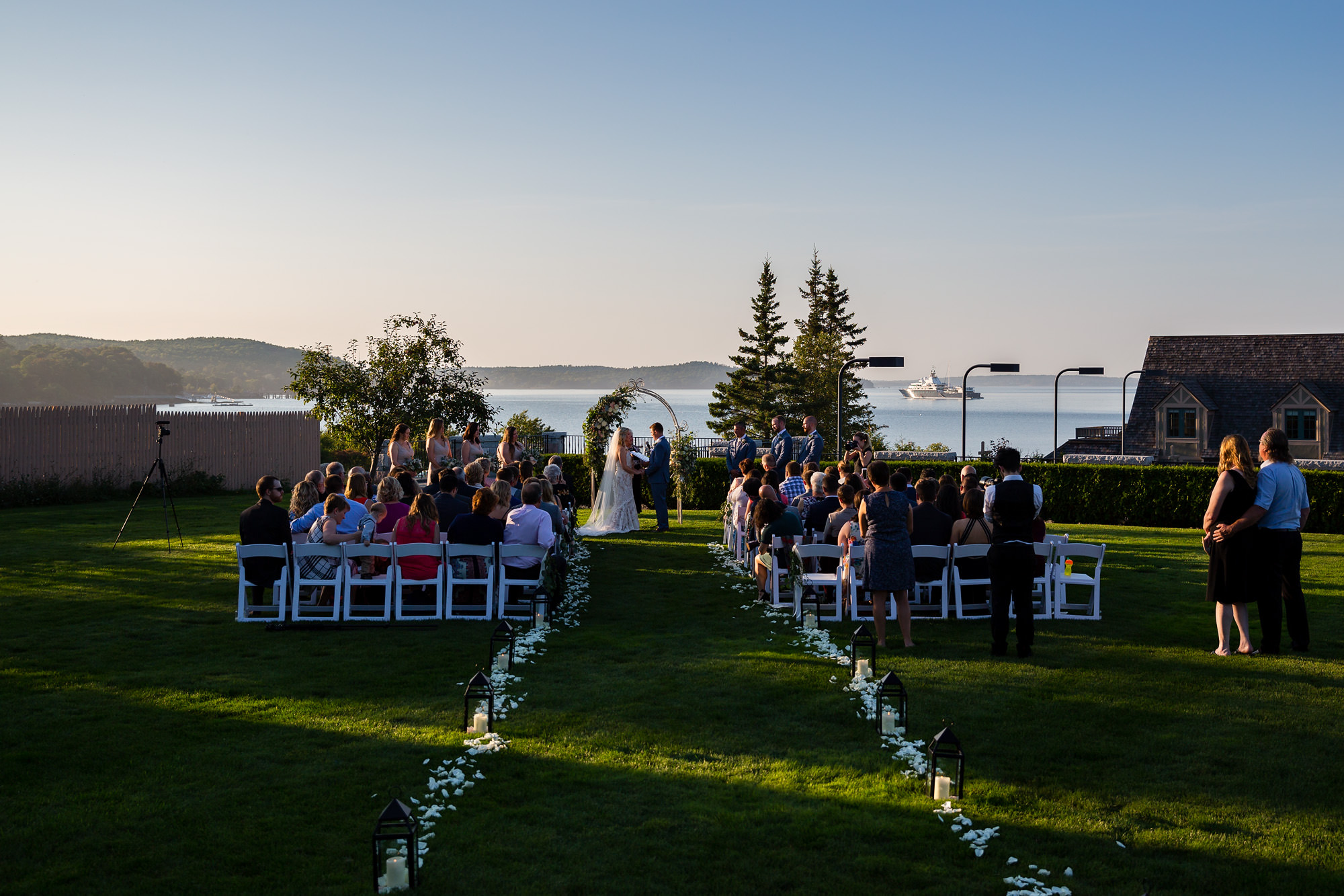 The sun begins to set on a wedding taking place in Bar Harbor.