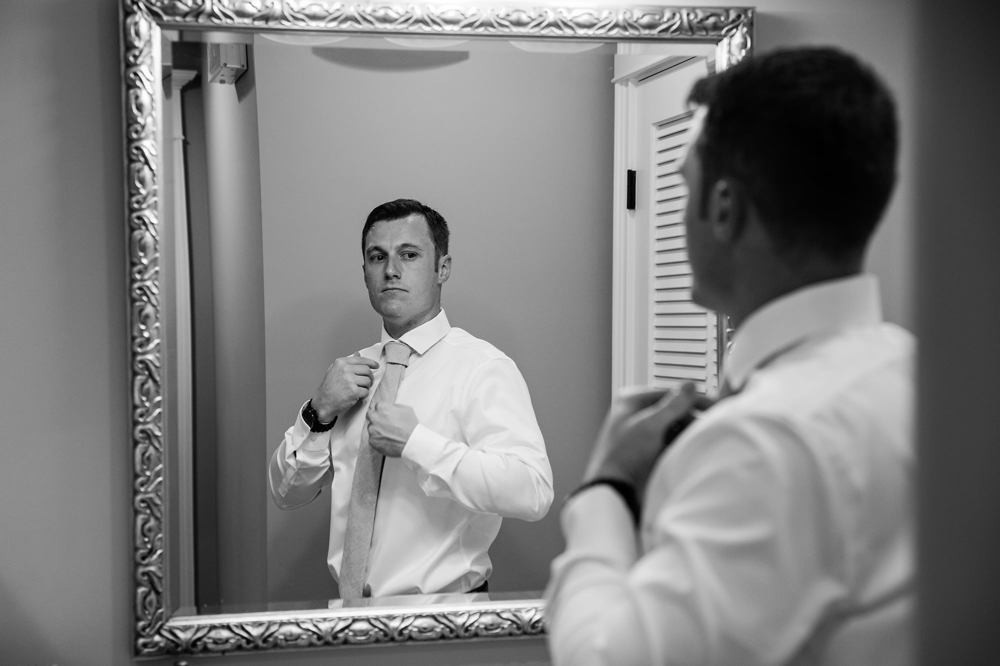 A groom gets ready for his wedding at Bar Harbor Club