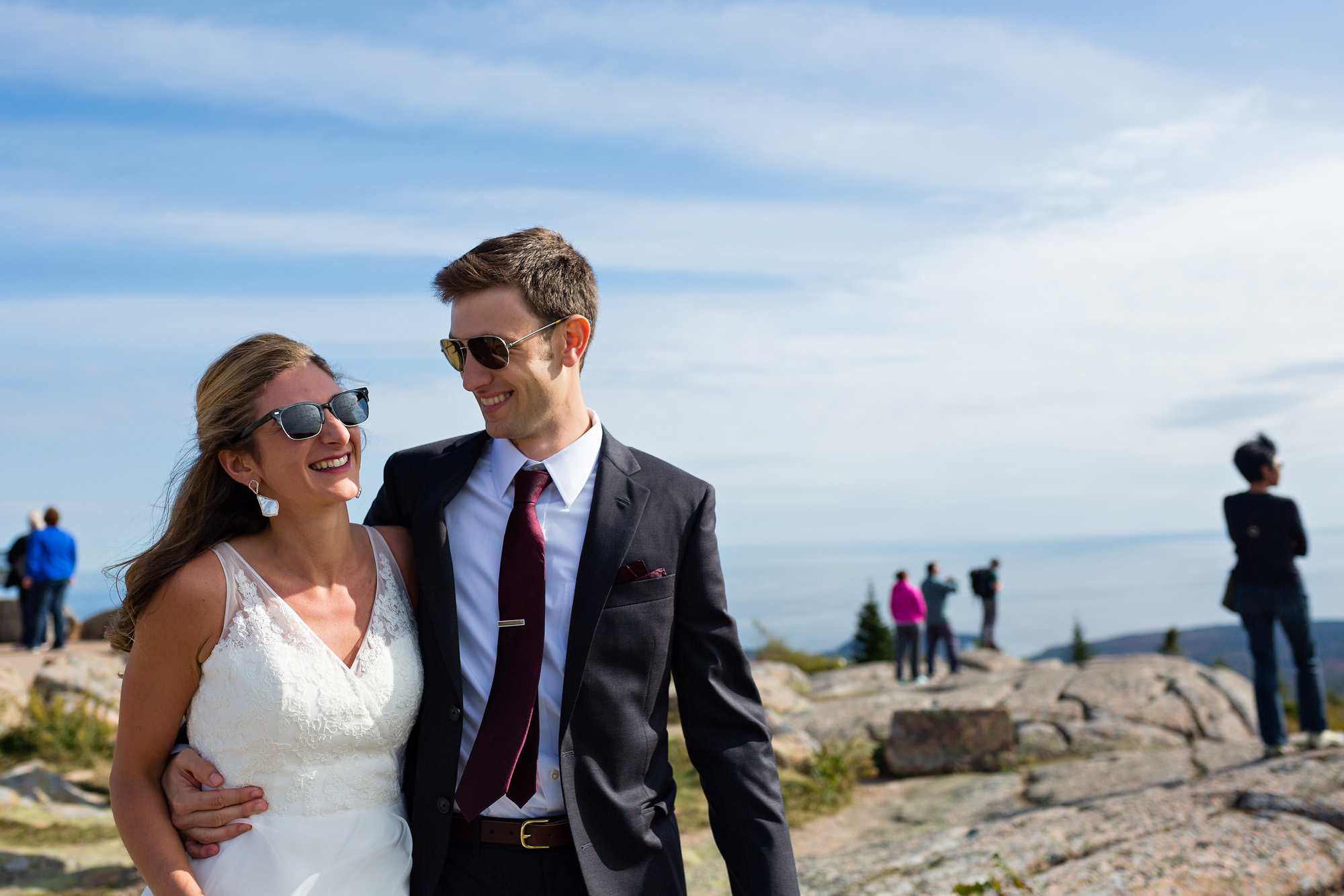 The bride and groom happily spend time on Cadillac mountain before their wedding ceremony