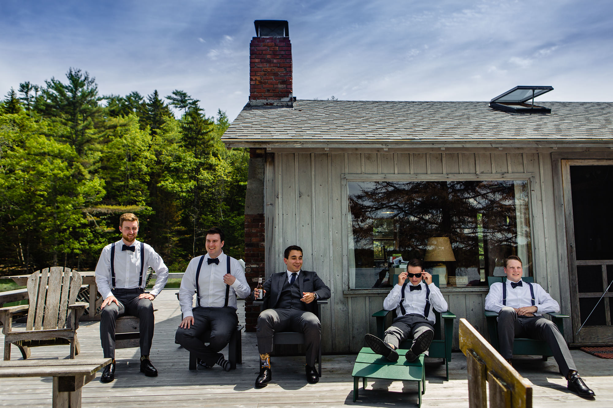 A groom and his groomsmen get ready at a cabin for his coastal Maine wedding