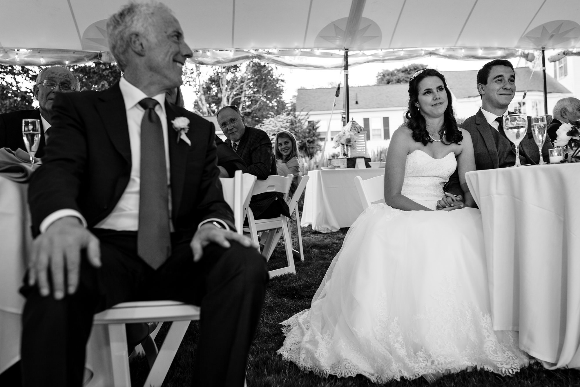 A bride adn groom share an emotional moment during their Maine wedding reception.