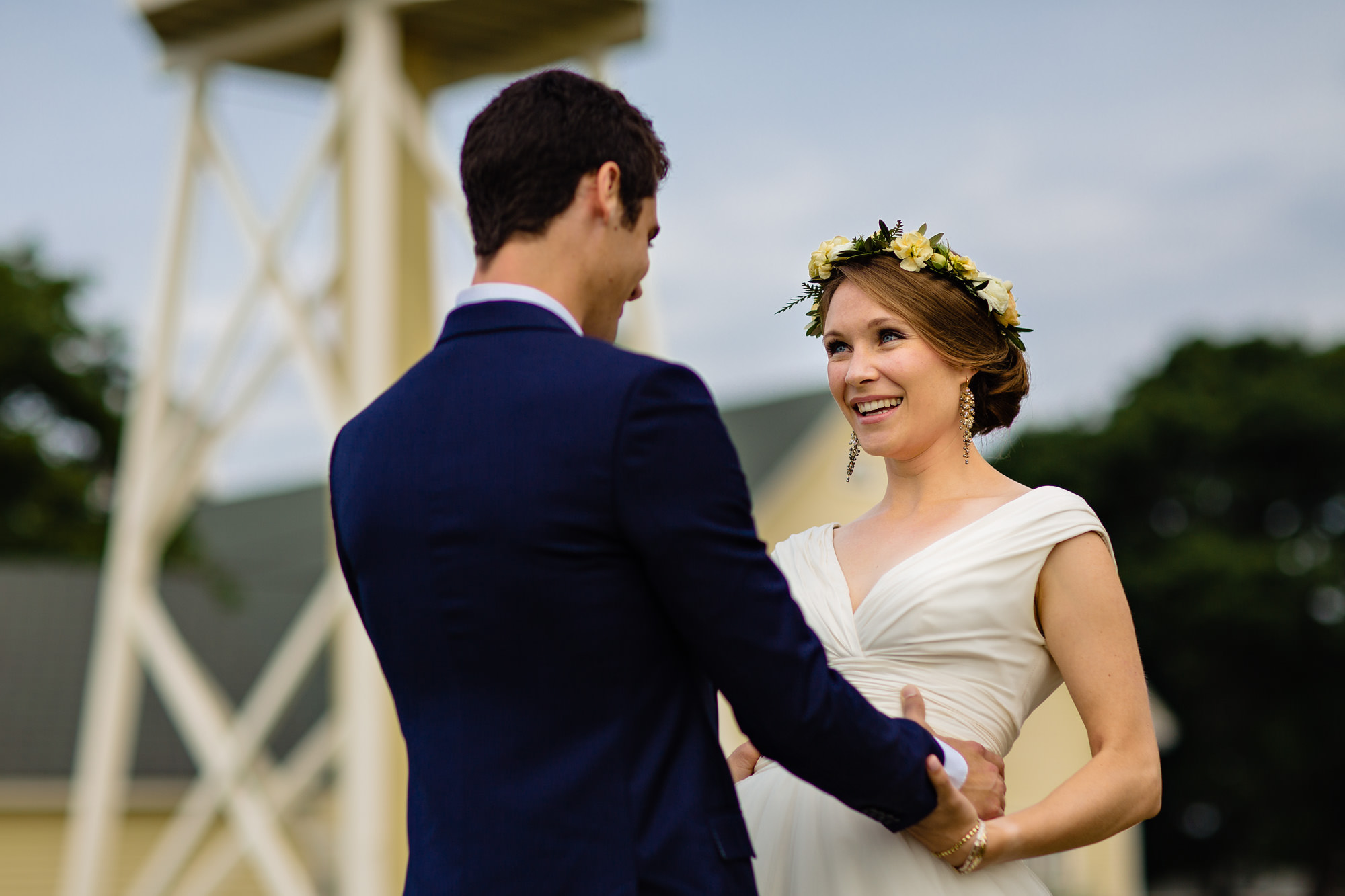 A bride and groom share a first look at Laudholm Farm in Wells, Maine