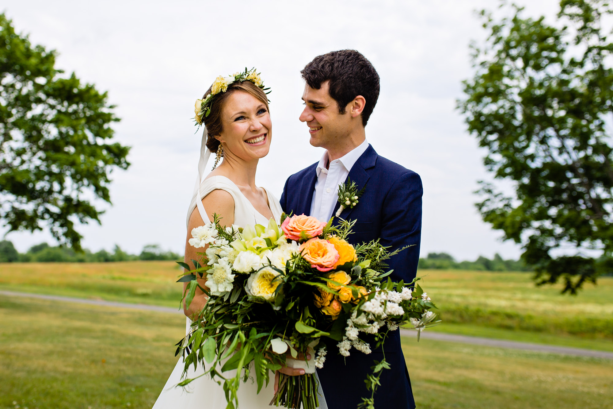 A bride and groom share a first look at Laudholm Farm in Wells, Maine