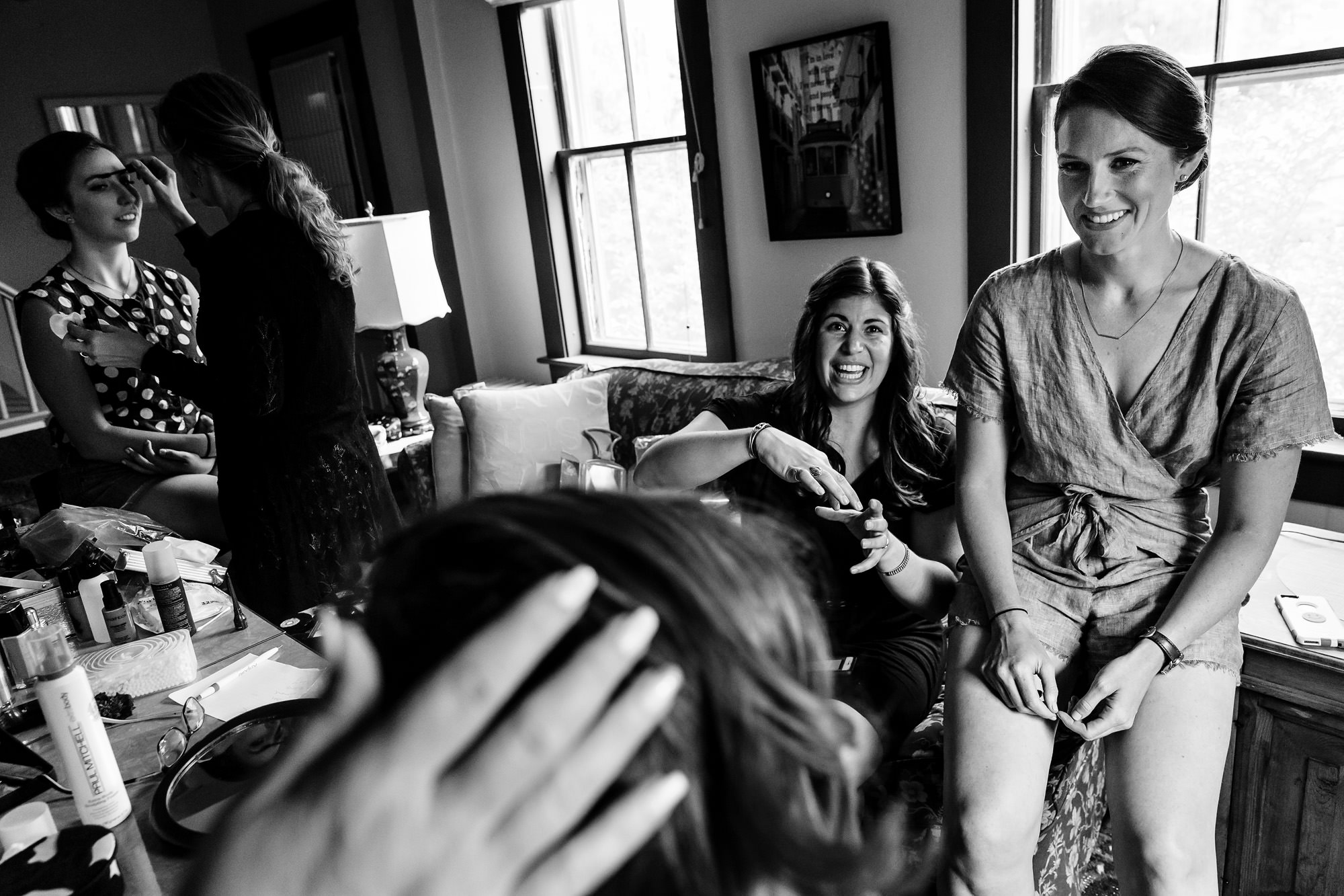 A bride prepares with her friends for her Wells Reserve at Laudholm Farm Wedding
