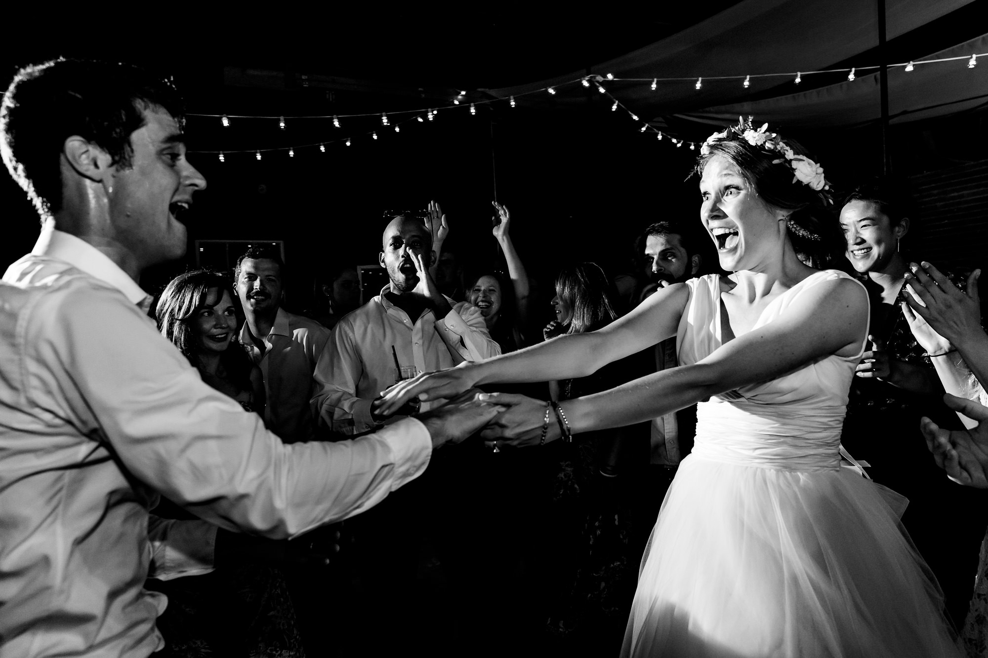 A wonderfully candid and fun dance floor at a wedding at Wells Reserve at Laudholm Farm in Maine