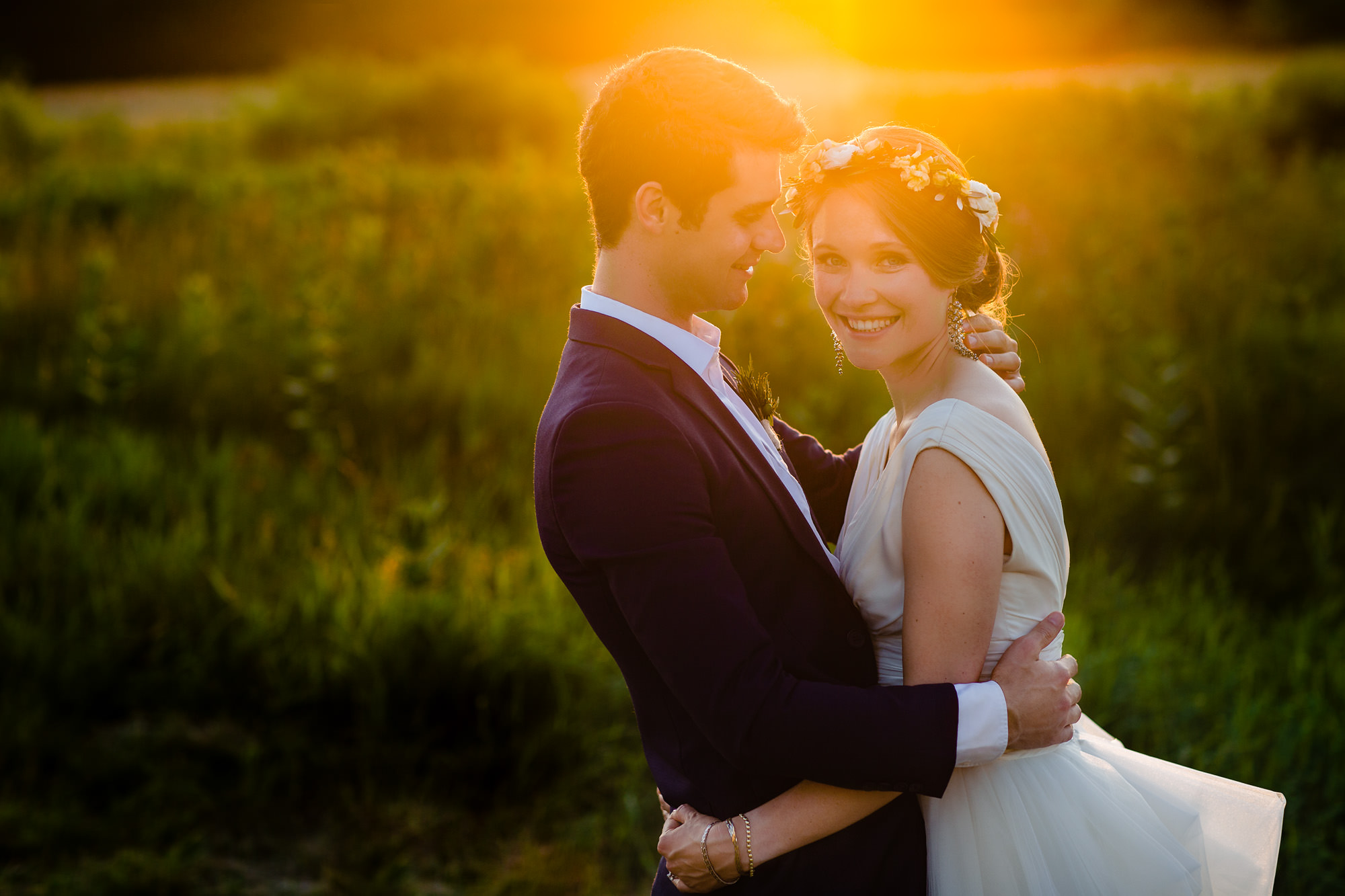 A beautiful sunset wedding portrait taken at Laudholm Farm in Wells, Maine