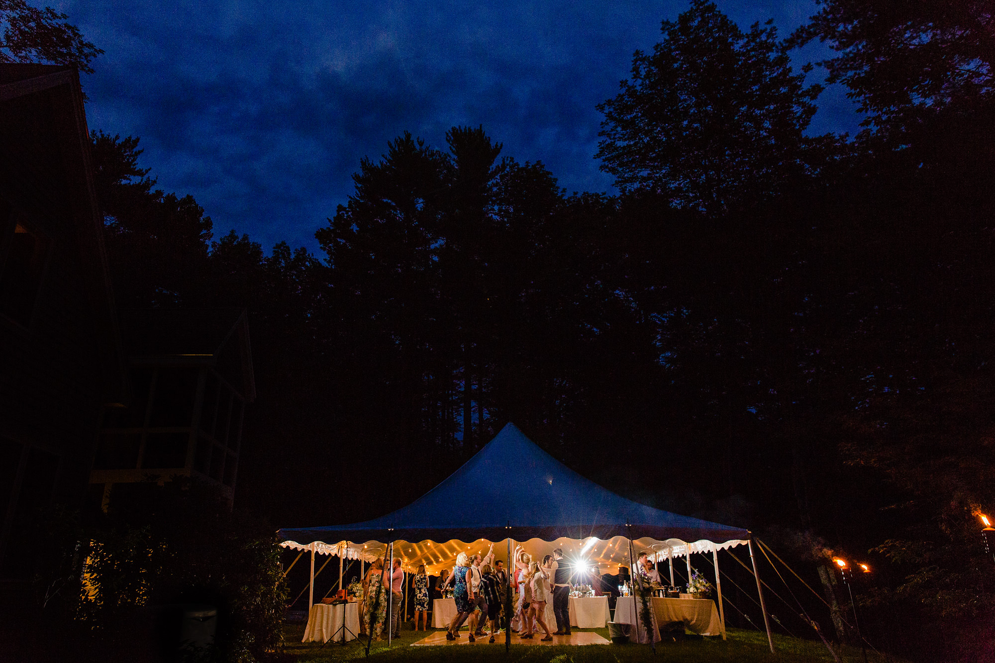 A documentary photo of an energetic Maine wedding dance floor.