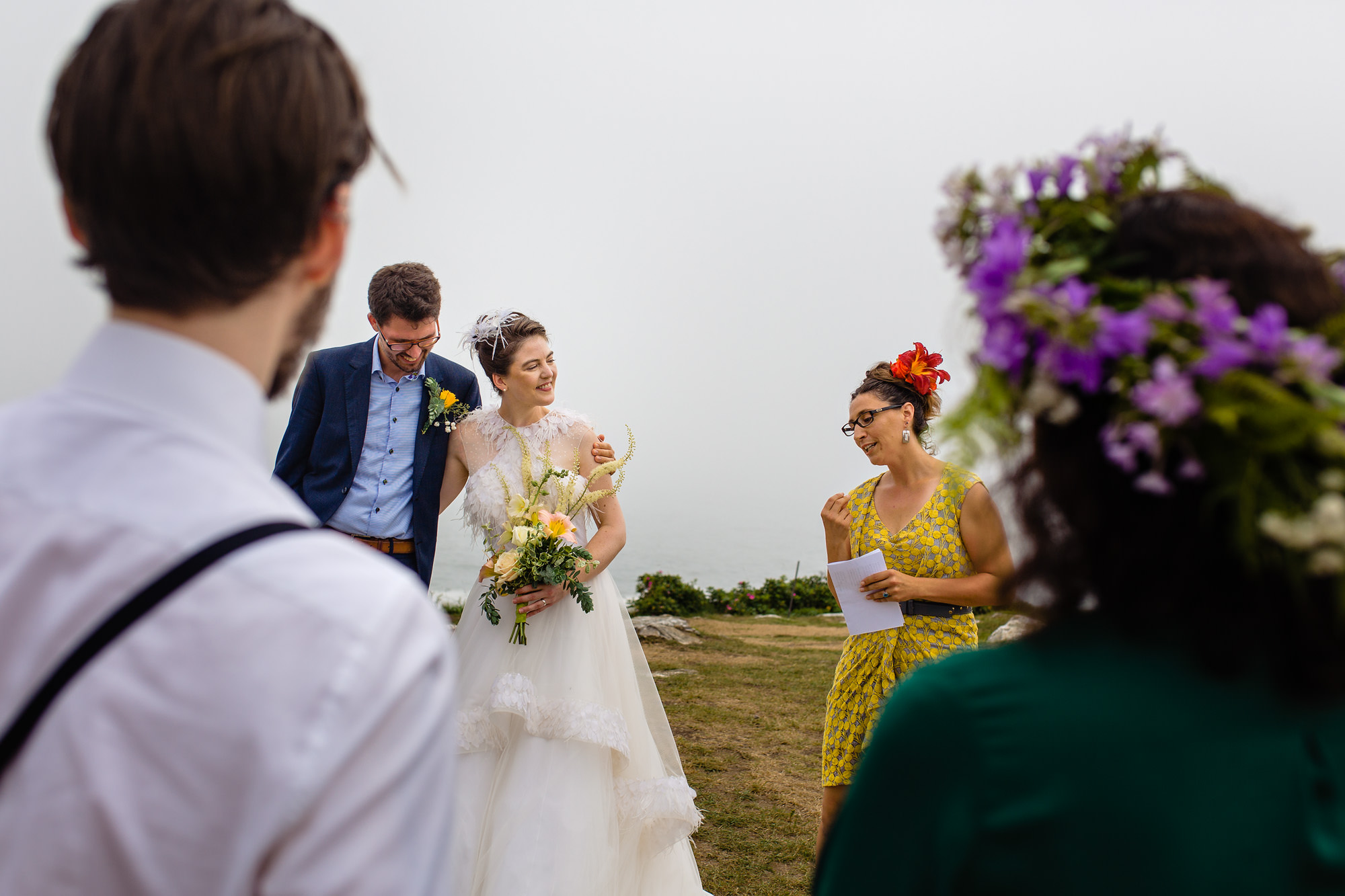 A small wedding ceremony at Pemaquid Point Lighthouse in Maine
