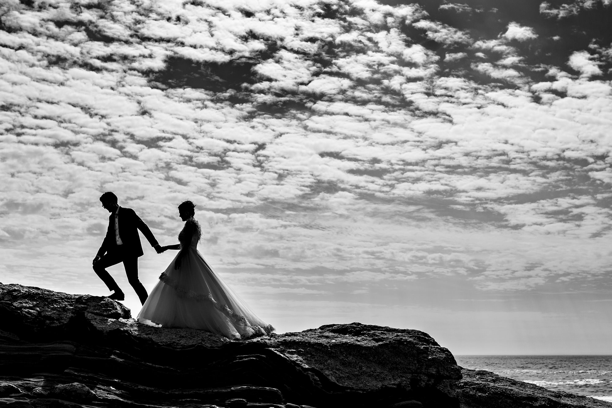Wedding portraits taken at Pemaquid Point Lighthouse in Maine